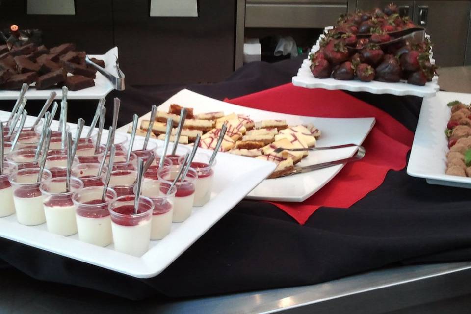 Dessert Display with Raspberry Panna Cotta, Assorted Cheesecake Squares, Homemade Brownies, Chocolate covered Strawberries