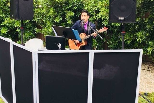 Adam with guitar and vocals