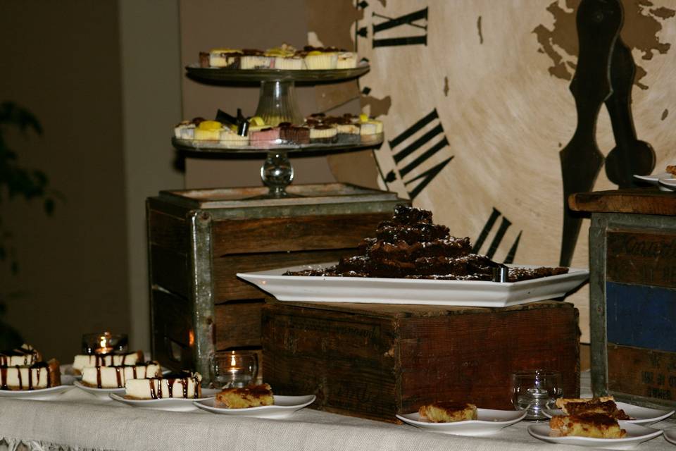 We did the rehearsal dinner for this bride and groom.  We used vintage crates and our oversized clock for the dessert bar.