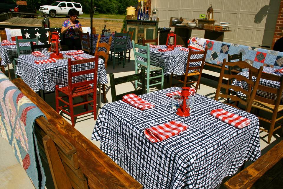 This was our set-up for a memorial day BBQ couples shower.  We used our primitive pews, ladder back chairs, Gentleman Jack, quilts, oil lanterns...    the devil is in the details.
