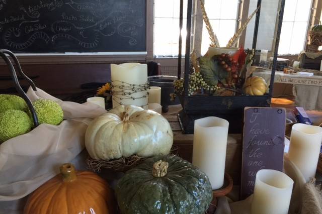 A fall wedding at one of our favorite sites...   the historic schoolhouse in Fayetteville.  This bride wanted a rustic, vintage vibe.  Since it was an early November wedding/reception, we incorporated colorful pumpkins and hedge apples.  These complemented the bride's sunflowers very nicely!