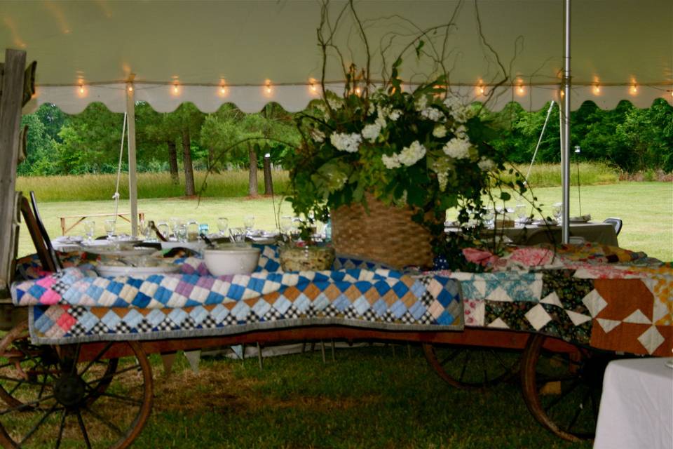 A spring garden wedding with lots of rustic, vintage, shabby-chic details.  This is our antique farm wagon...   fabulous for serving food buffet style!