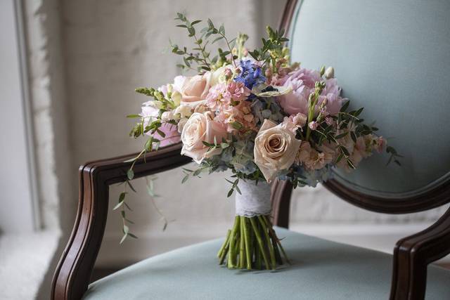 Image by Dustin Lewis. Vivid Expressions LLC custom Design Bridal Bouquet.  Event design, flowers, and decor by Vivid Expressions for client's wedding reception at The Historic Post Office, Hampton, Virginia.  Wedding Stylist.  Event Design and Floral Design presentation.  Event planning, wedding planning, wedding design, event design, wedding flowers, event flowers and decor.  Luxury wedding, Luxury event design planning, destination wedding