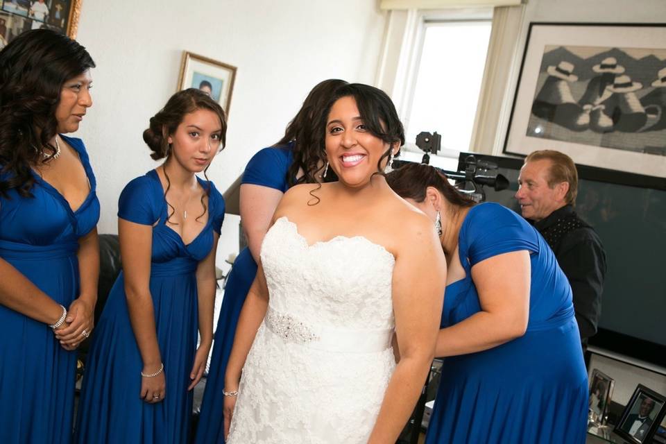 Bridesmaids helping out the bride
