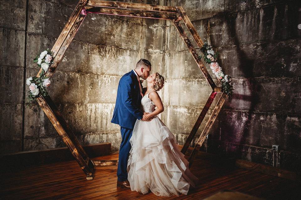 Bride and groom with archway