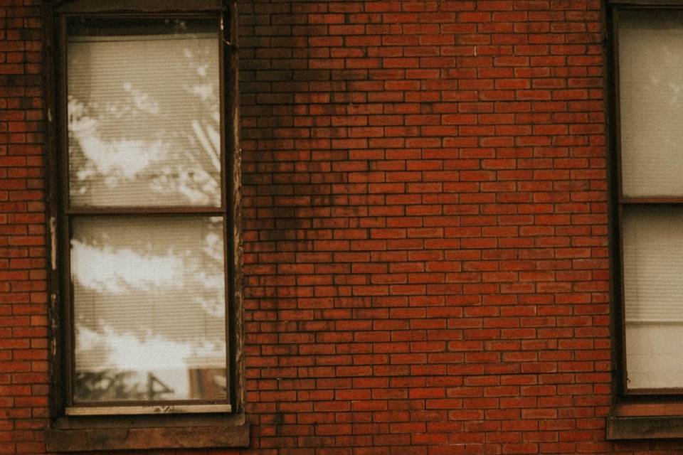 Bride and groom with brick