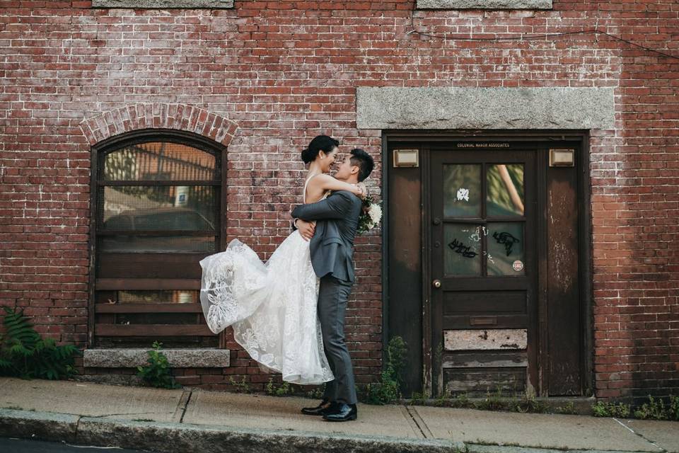 Bride and groom with brick