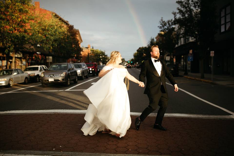 Bride and groom with rainbow