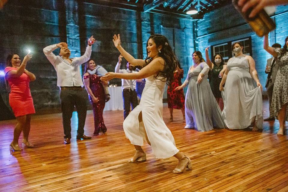 Bride dancing with uplights