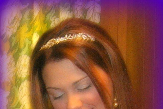 a close up of bride Jamie as she watches her mother straighten her gown