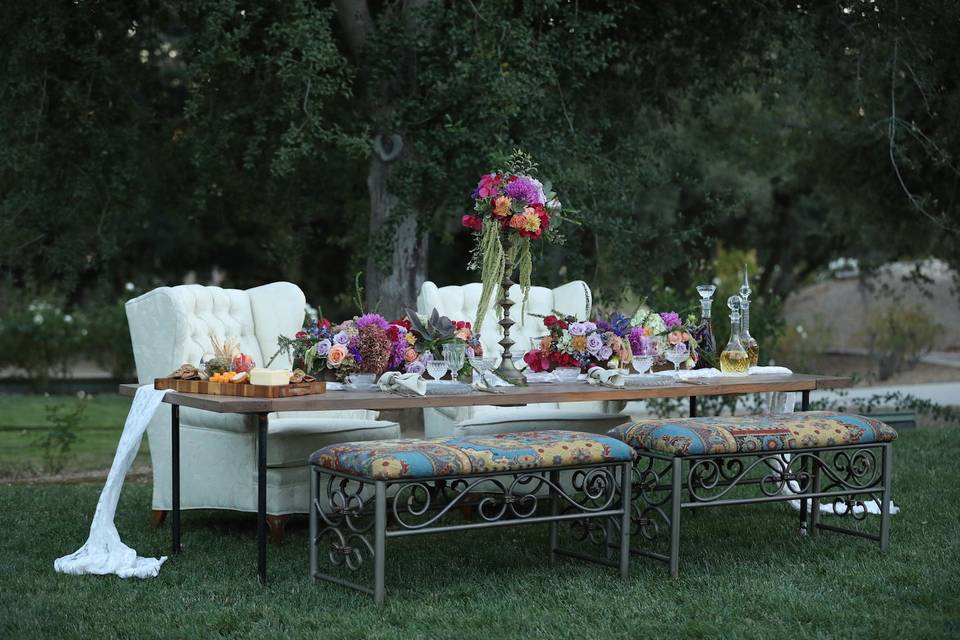 Boho eating area with industrial farm table.