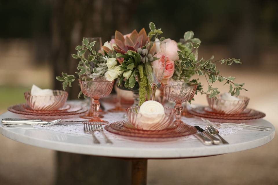 Pink Swirl depression glass table setting with vintage silverware.