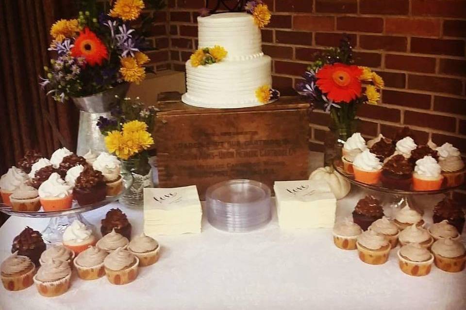 Wedding cake and cupcakes