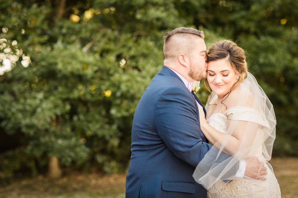 Groom kisses his bride