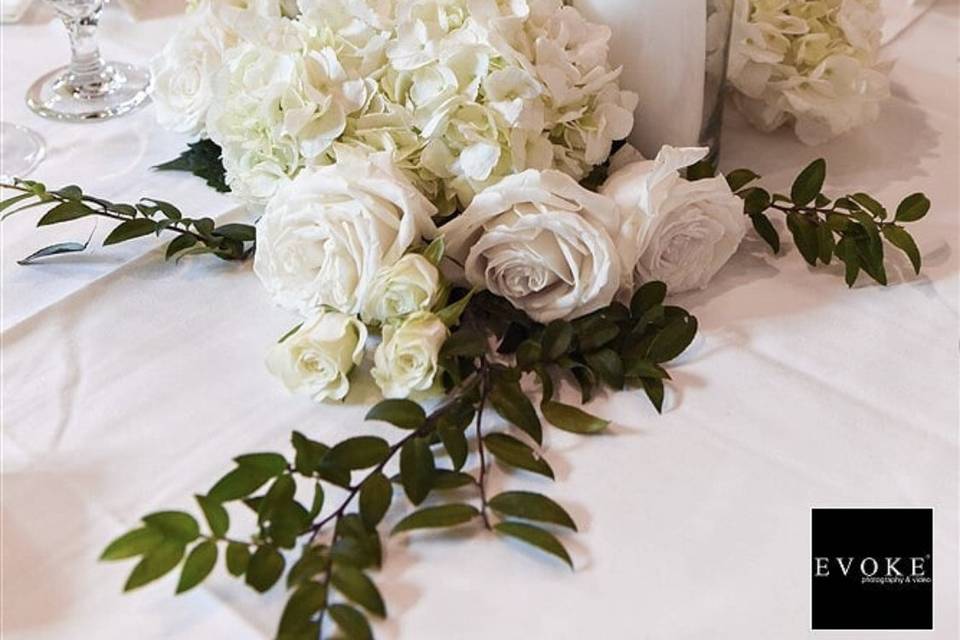 Long white table with candles