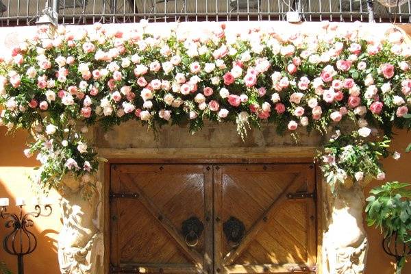 Stunning, beautiful, artistic doors at Trois Estates.  I love being able to utilize the space above and bring it into the celebration...  alive with hundreds of roses and flowers.  It is stunning and the atmosphere comes alive ~ and smells wonderful.