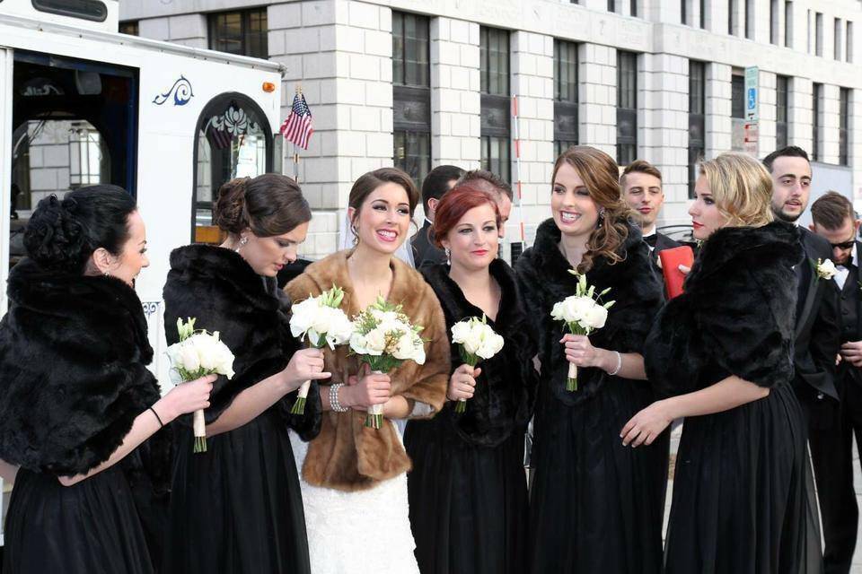 Bride and bridesmaids in their coats