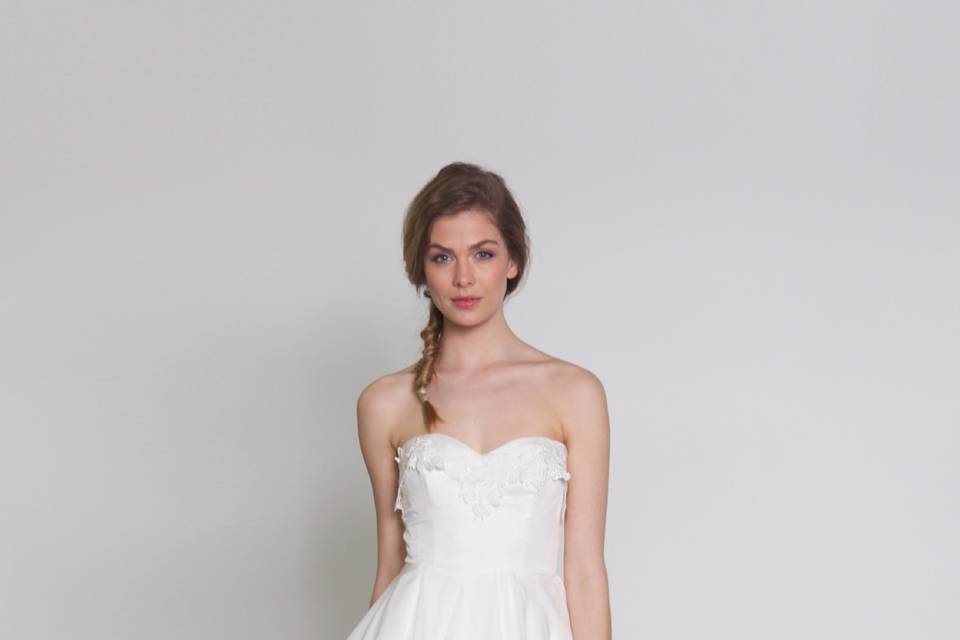Southern Nights
Strapless dress with guipure lace  applique and raw edge cascade skirt