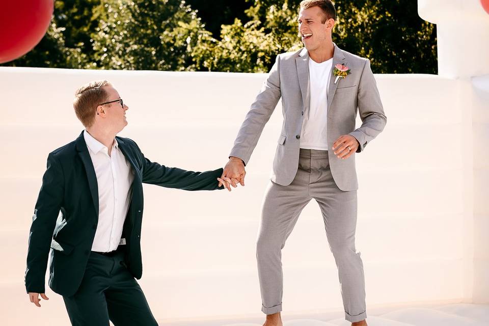 LGBTQ+ couple on bounce house