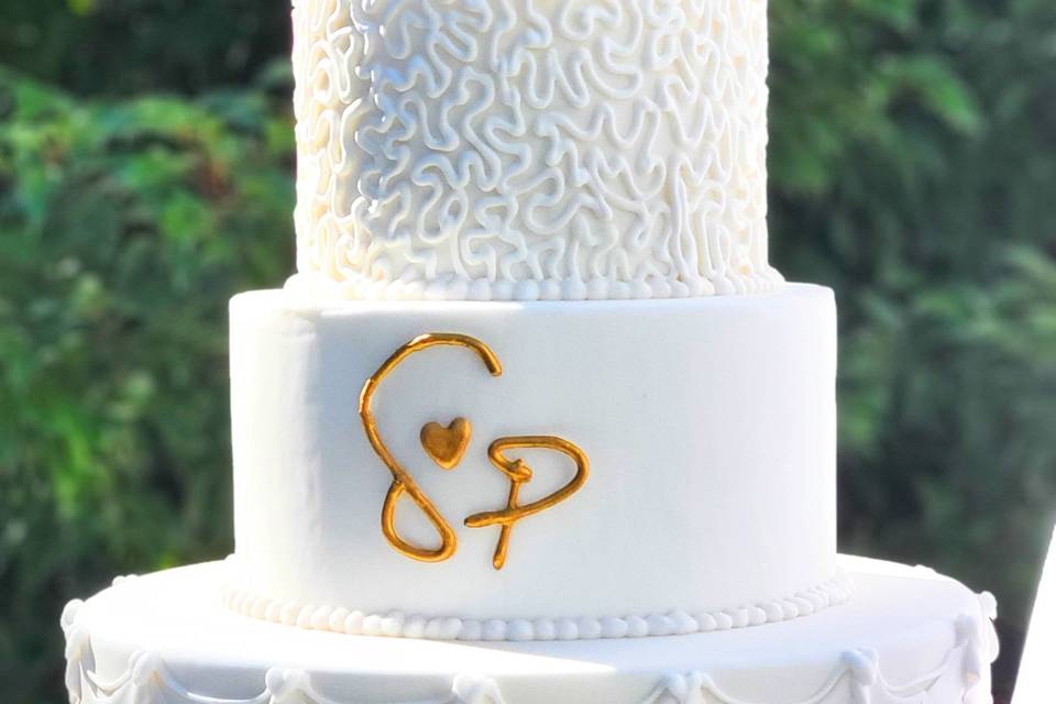 White and gold wedding cake