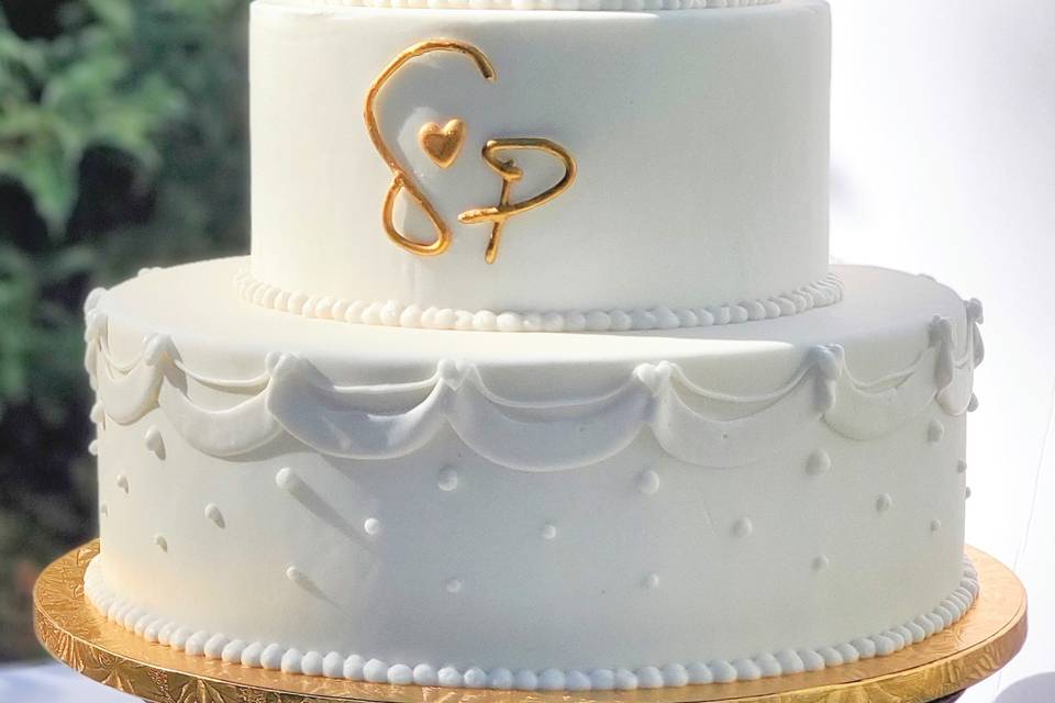Gold monogram cake decor