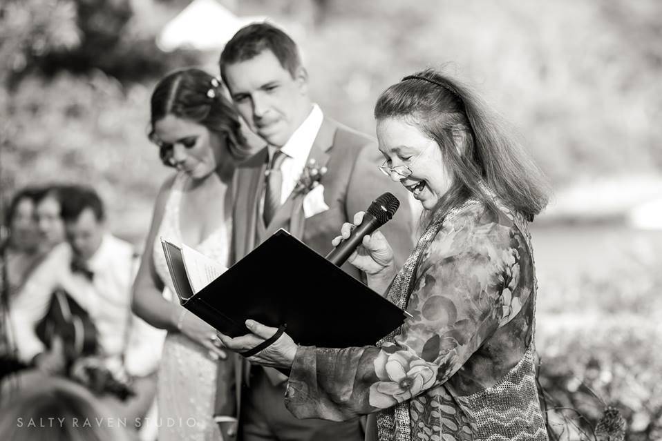 Celebrant stands to the side