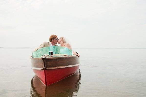 norther minnesota wedding with bride and groom on a boat