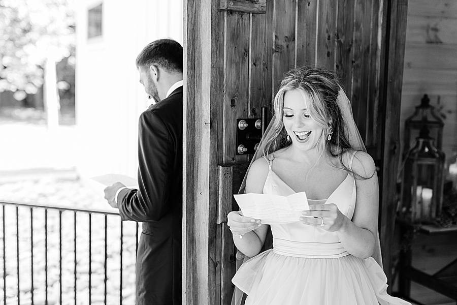 Bride and groom reading letter