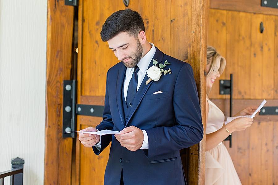 Bride and groom reading letter