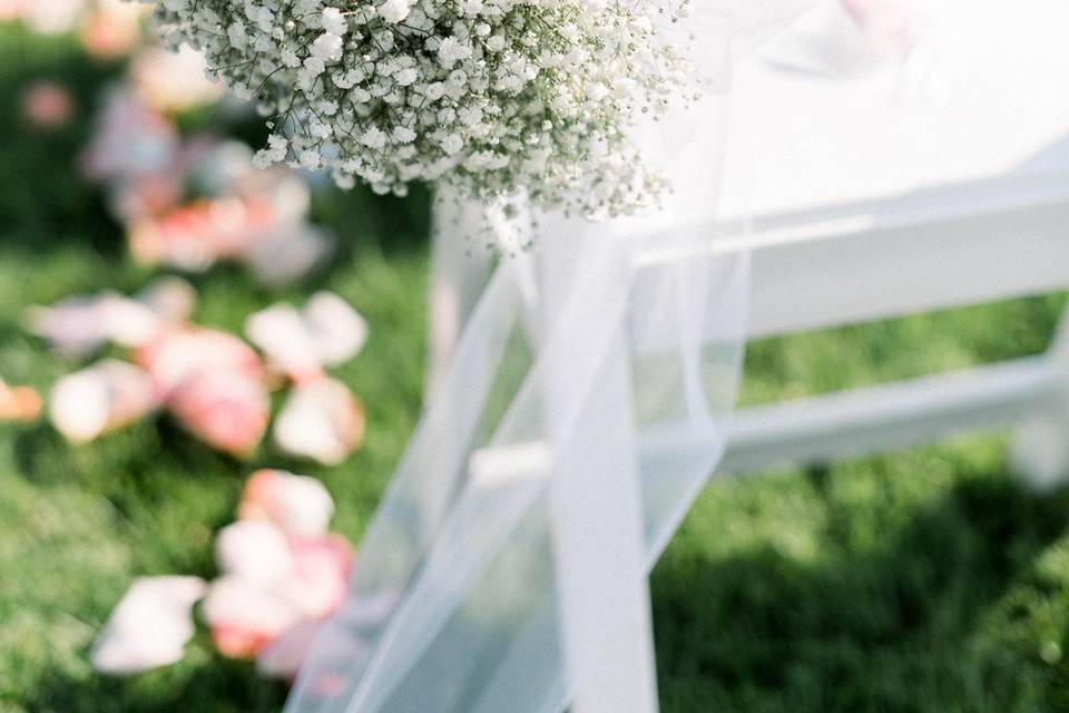 Baby’s breath aisle chair deco