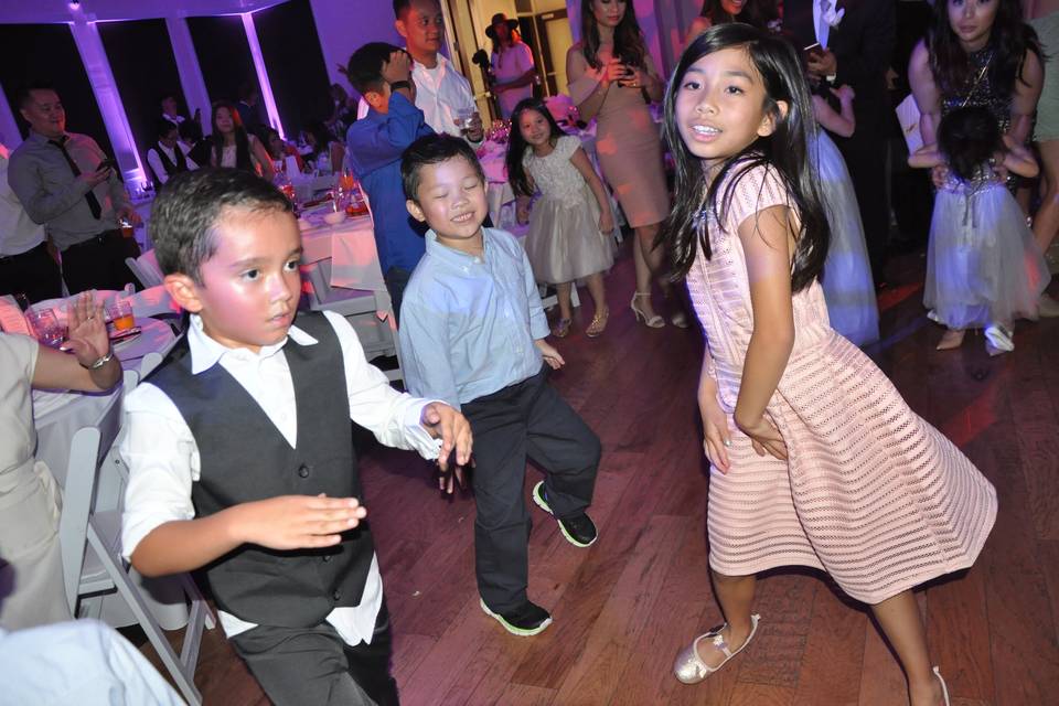 Kids having a blast at wedding