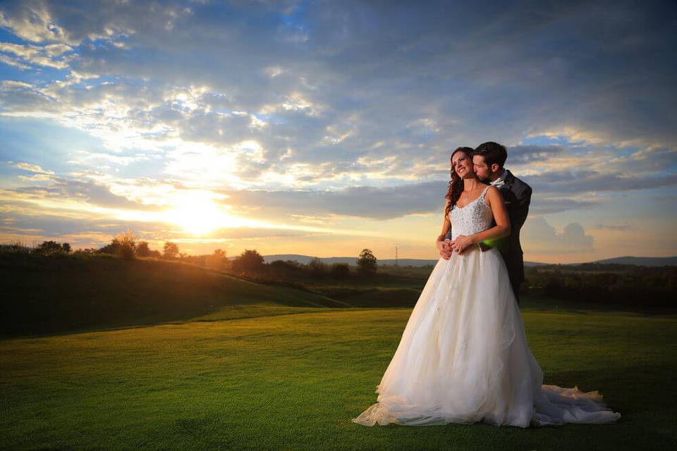 Bride and Groom at sunset Maryland National Golf Club wedding