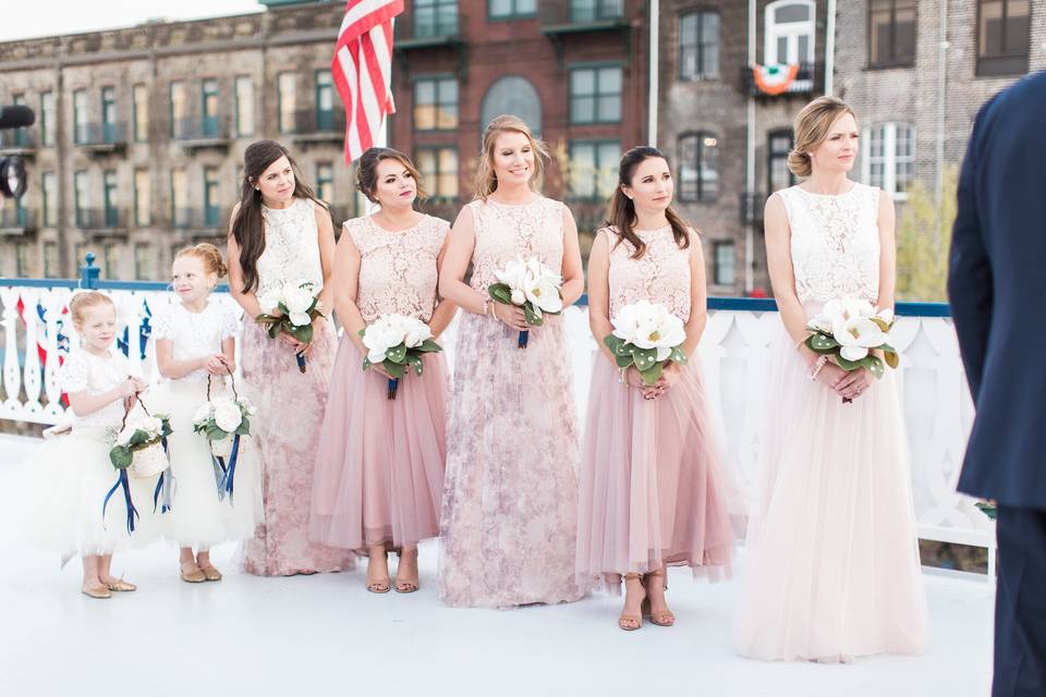 Bride, bridesmaids, and flower girls