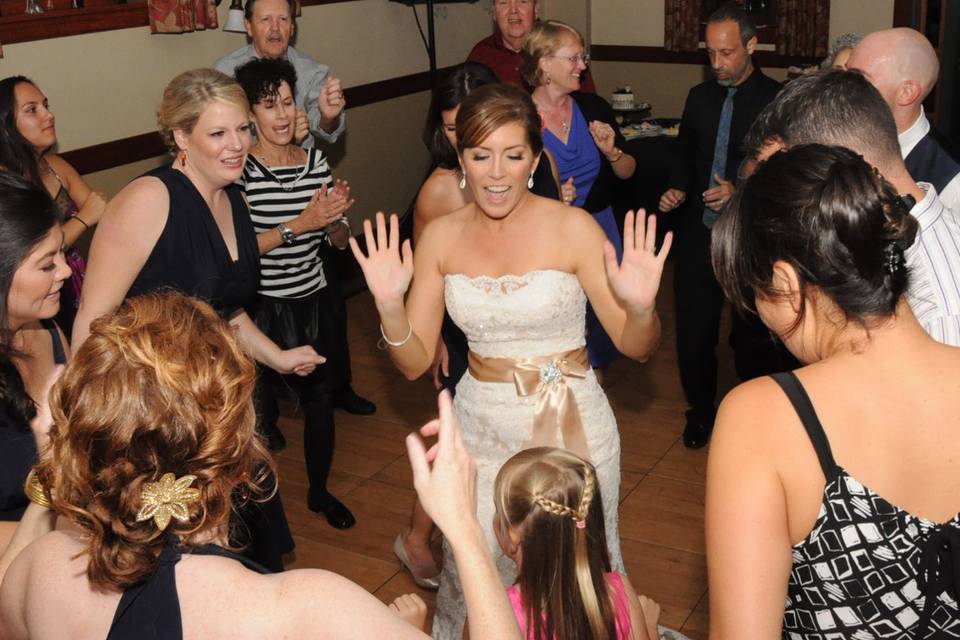 Bride and guests dancing