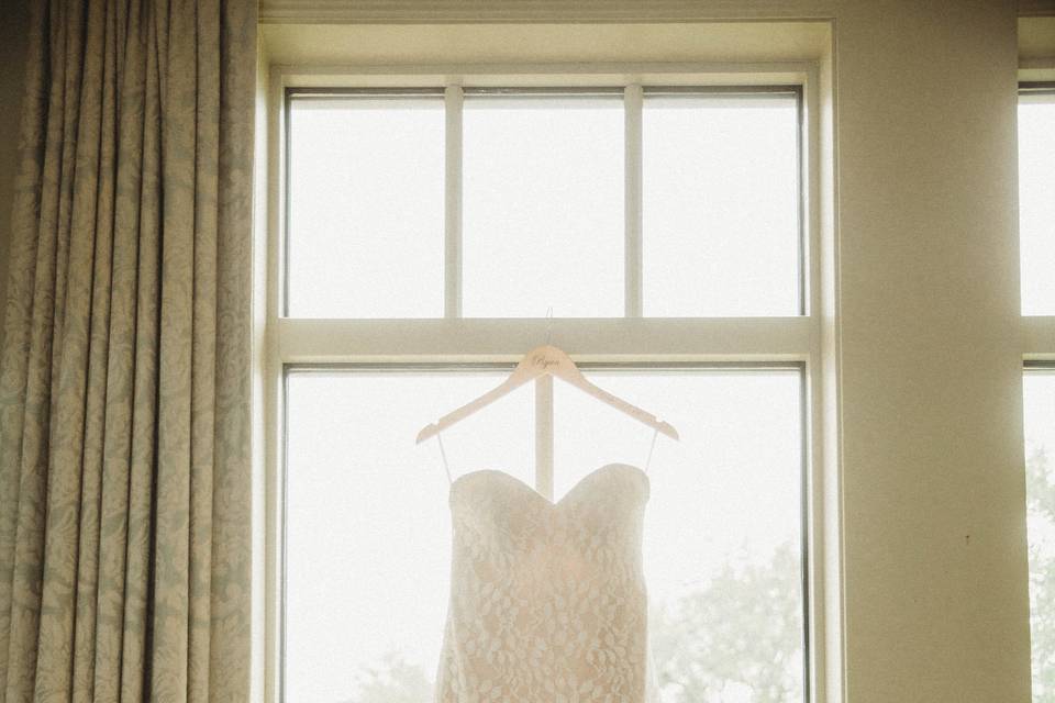 Dress hung by window
