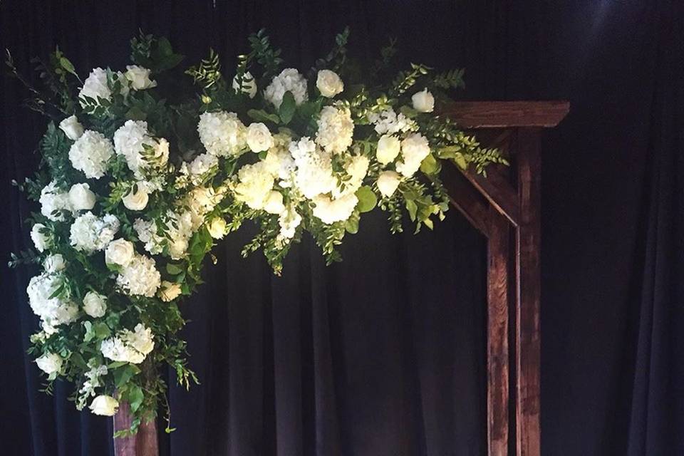 Arbor ceremony florals