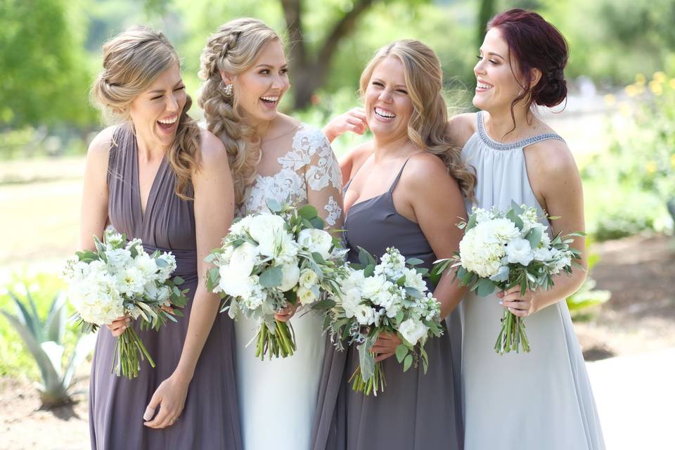 Beautiful bouquets of peonies, hydrangea, dahlias, lisianthus, stock & a mix of eucalyptus, dusty miller & olive branch hand tied with ivory ribbon.