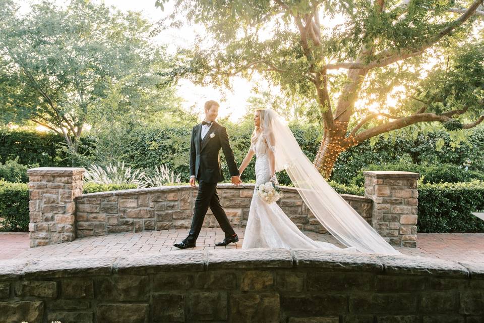 Newlyweds on stone bridge