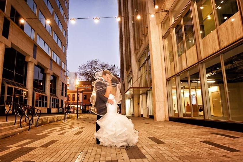 Bride and groom on Fayetteville Street in Raleigh, NC