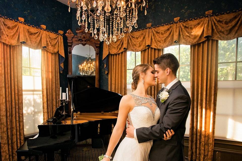 Bride and groom at the Preston Woodall House with a piano