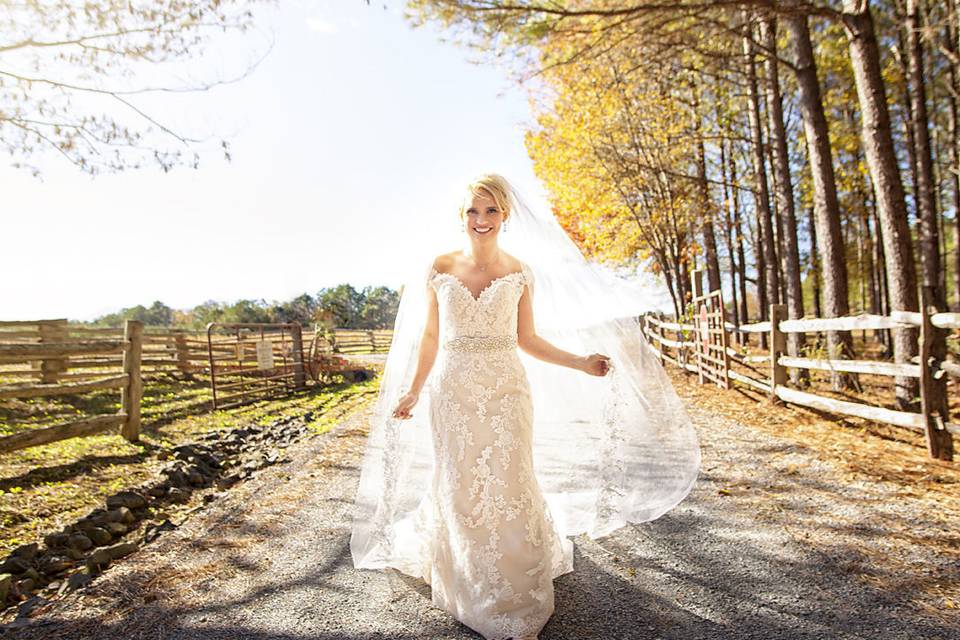 Bridal photo at Shady Wagon Farm in a lace gown and long veil