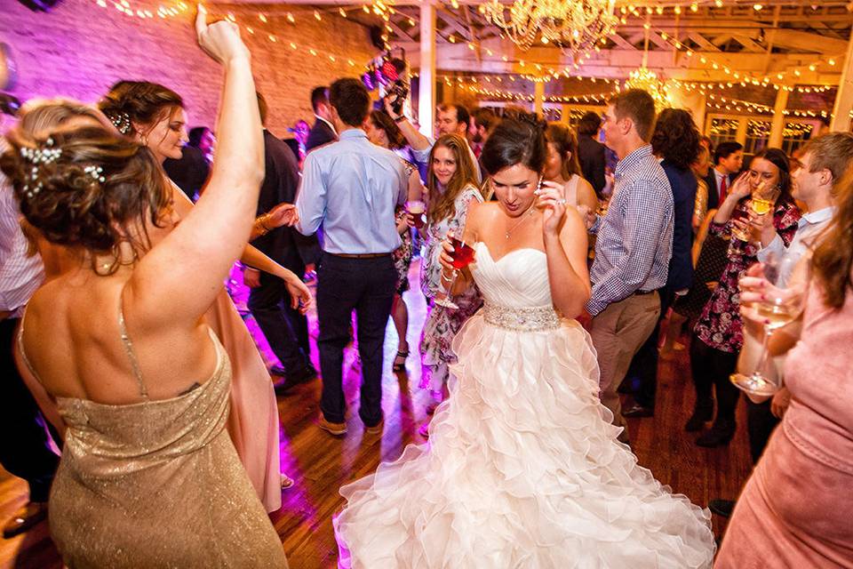 Bride dancing at her reception at Stockroom in Raleigh, NC