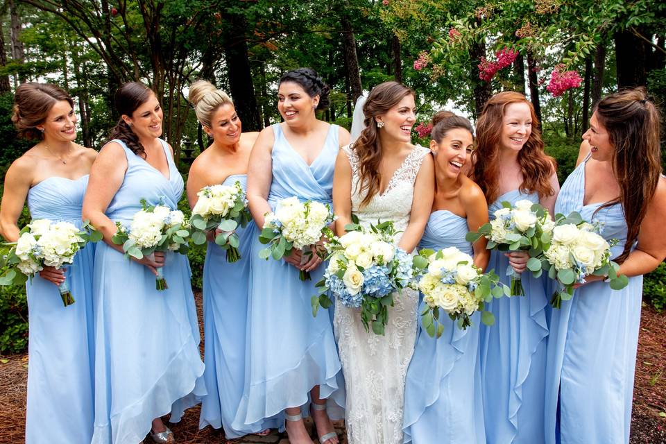 Bridal party in blue dresses at the azalea park