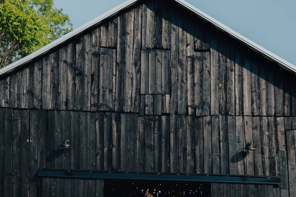 Newly weds outside the barn