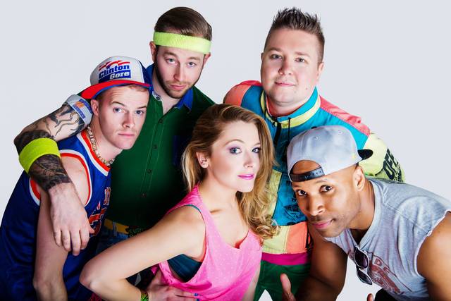 Band in 90s costumes
