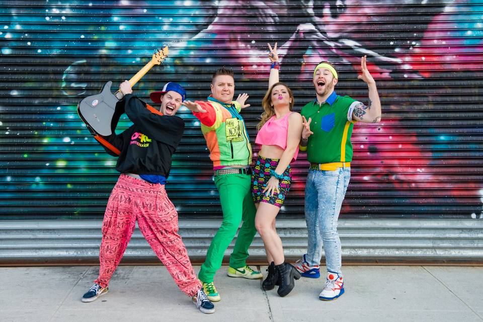 90s outfits with graffiti backdrop