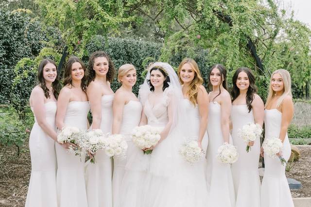All white bridesmaid dresses.