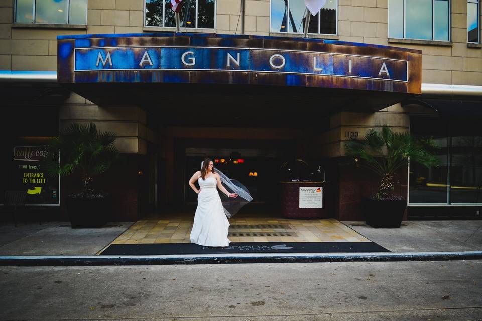 Bride in front of the hotel