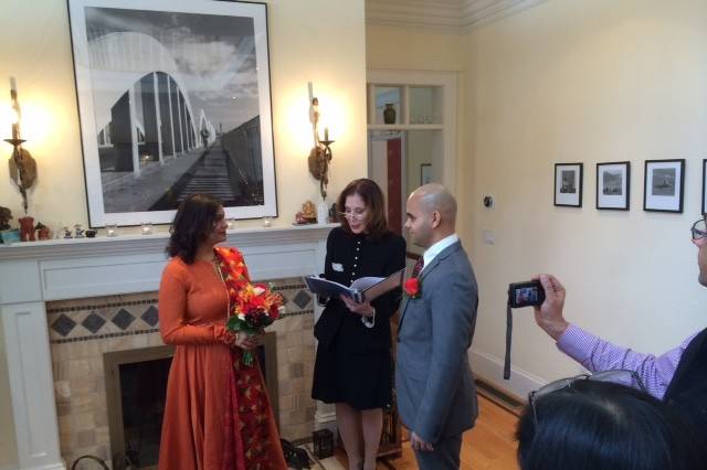 The newlyweds and the officiant