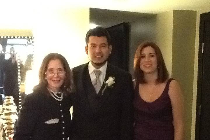 The newlyweds and the officiant
